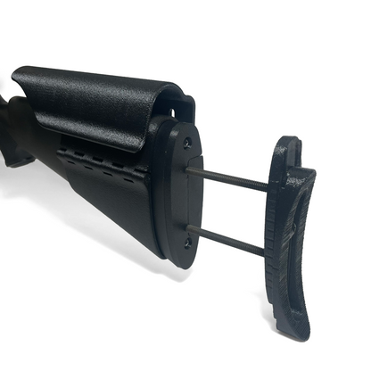 Close view of rifle buttstock showing adjustable length of pull system installed