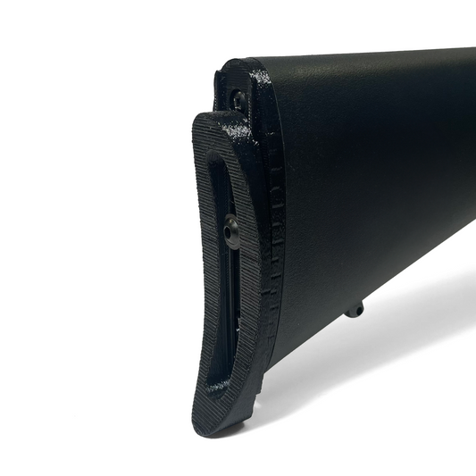 AIM Level 1 rifle adjustment kit installed on Savage MK II composite stock showing adjustable buttplate